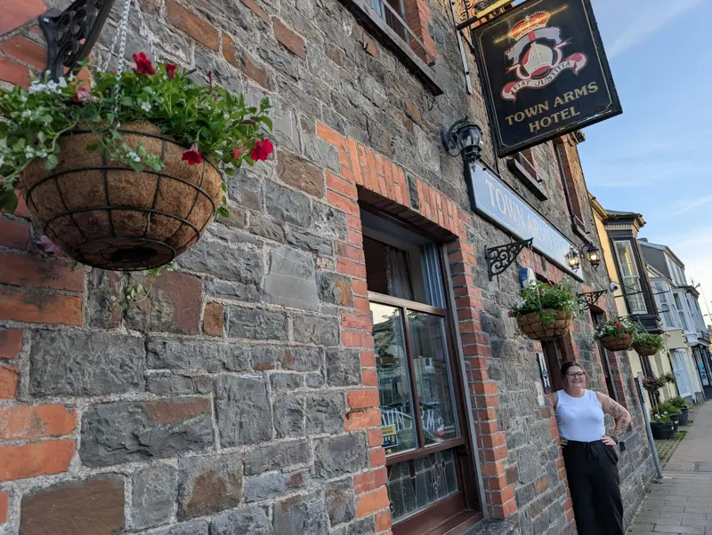 Town arms joining in with red and white hanging baskets for 2026